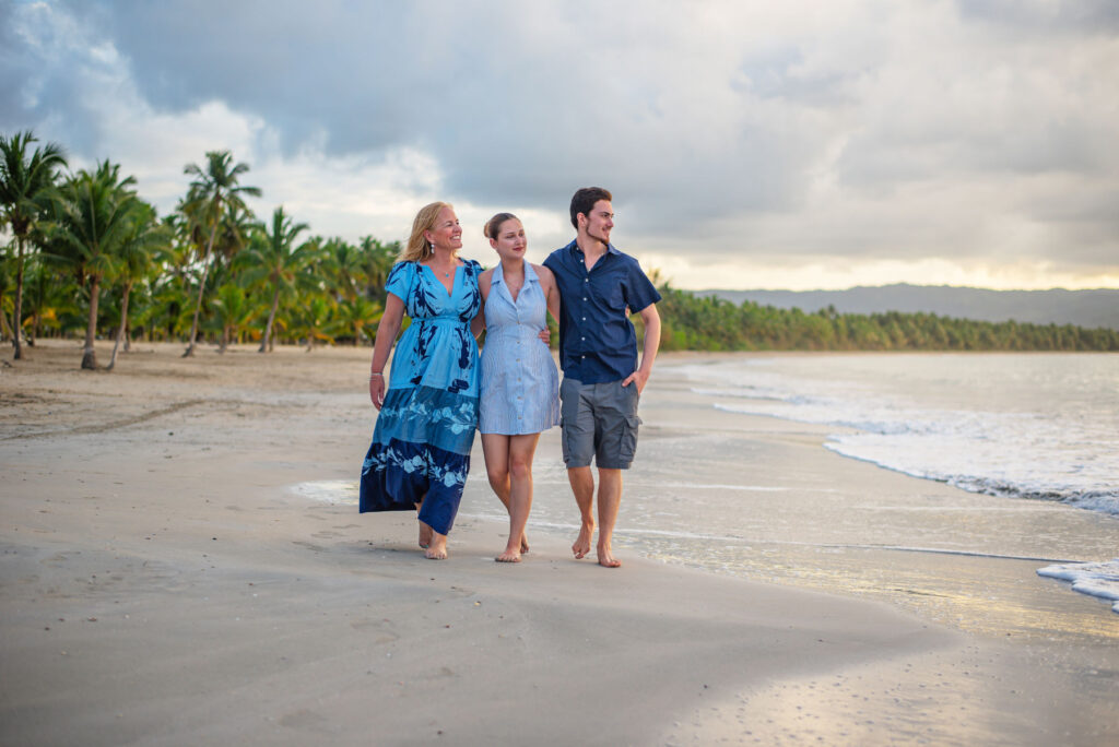 Laura Pineda walking on the beach with her children, Maya and Ruben
