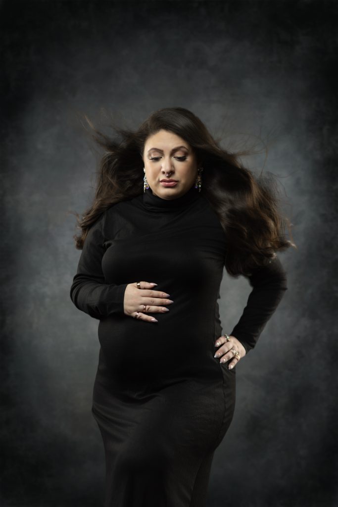 Stylish maternity portrait in a black dress by a Boston maternity photographer.