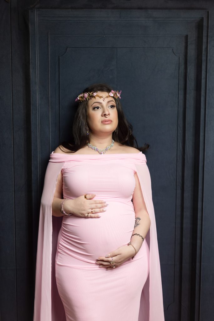 Pregnant mother wearing a pink maternity gown during a Boston studio maternity session.